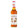 Monin Cinnamon Roll sirup 70 cl flaske med oransje væske og kanelbolle-etikett.