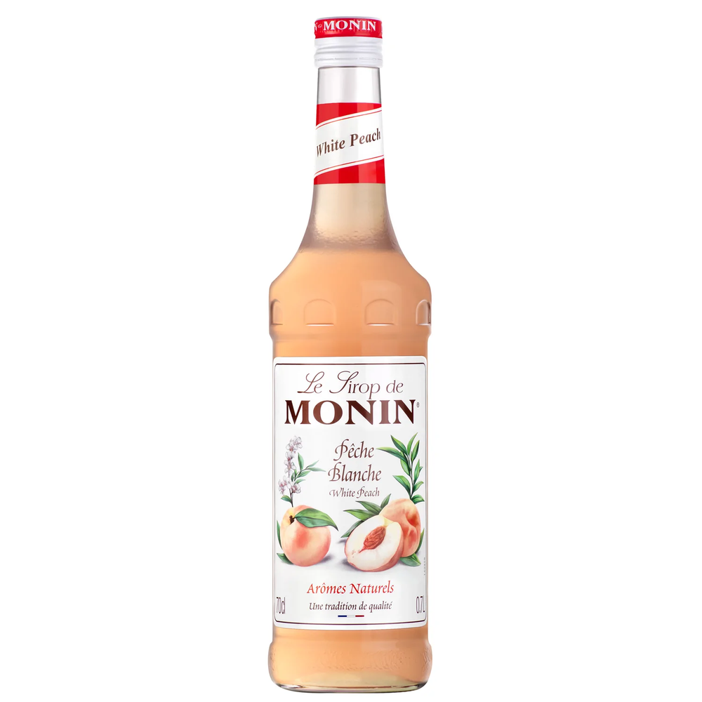 Monin Hvit Fersken sirup 70 cl i glassflaske med hvit og rød etikett, ferskenillustrasjoner.
