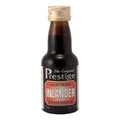 Prestige Inländer Romessens 20 ml flaske for 75 cl romdrikk – mørk væske, gullkork.
