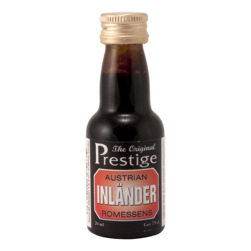 Prestige Inländer Romessens 20 ml flaske for 75 cl romdrikk – mørk væske, gullkork.