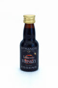 Strands Tennessee Whisky essens i liten brun flaske med gullkork, svart etikett.