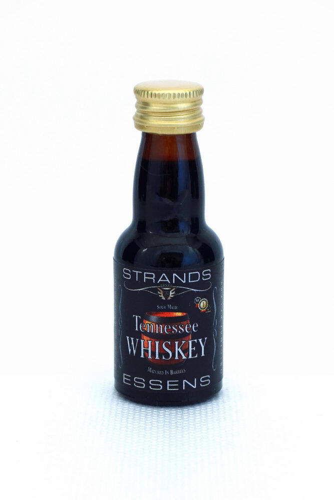 Strands Tennessee Whisky essens i liten brun flaske med gullkork, svart etikett.
