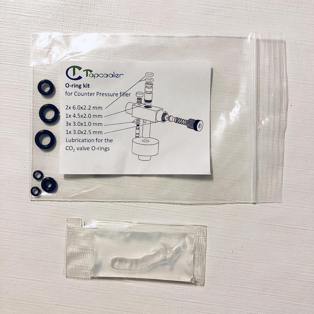 Tapcooler O-ring kit med diverse svarte pakninger og smøremiddel for mottrykksfyller.