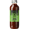 Traeger Sweet & Heat BBQ-saus 440ml i glassflaske med grønn etikett og sølvkork.